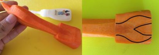 Tiếp theo gắn hạt tiêu sọ hai bên đầu làm mắt cá Hình con cá tỉa từ cà 7